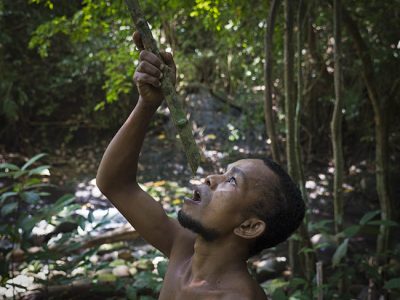 Man drinking from bamboo Jungle tour_Philippines